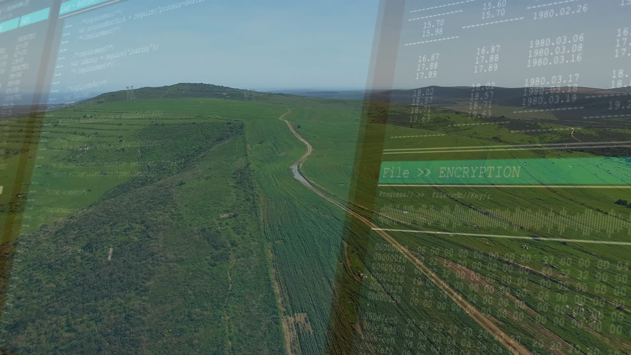 Rural farmland scene being shown from above, with winding dirt road and encryption code overlay