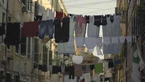 stretching across the buildings and balconies were countless rows of laundry lines, displaying the nation's attire