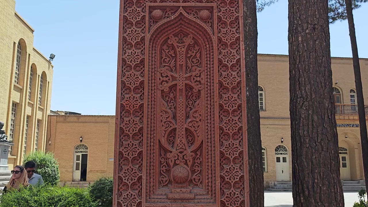 Intricate Armenian Khachkar Stone Cross in a Courtyard