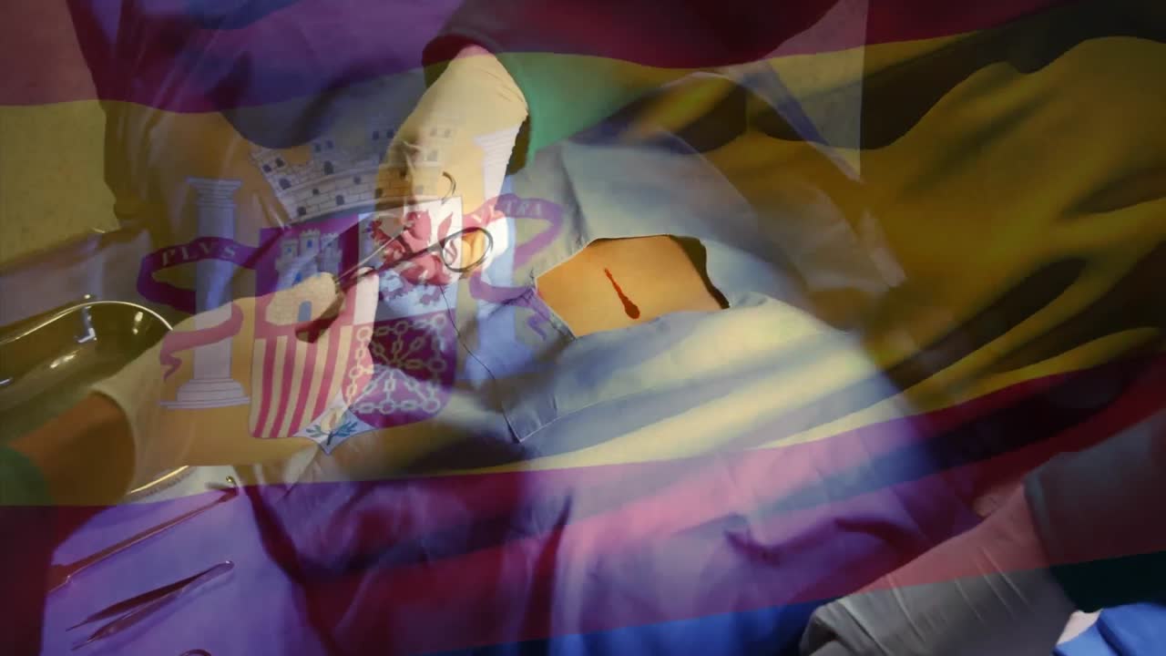 Animation of flag of spain over surgeons in operating theatre