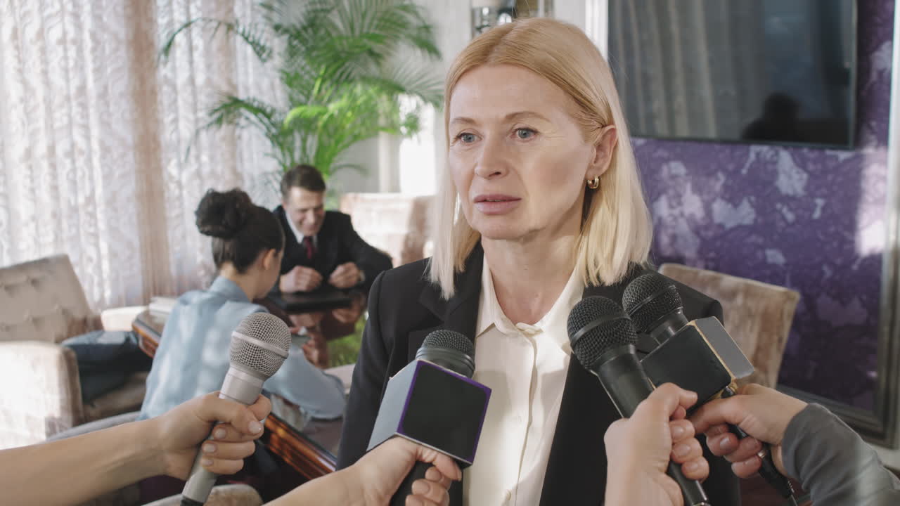 Business Woman Giving Interview At Press Conference