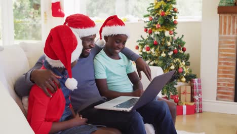 african american family having a videocall on laptop