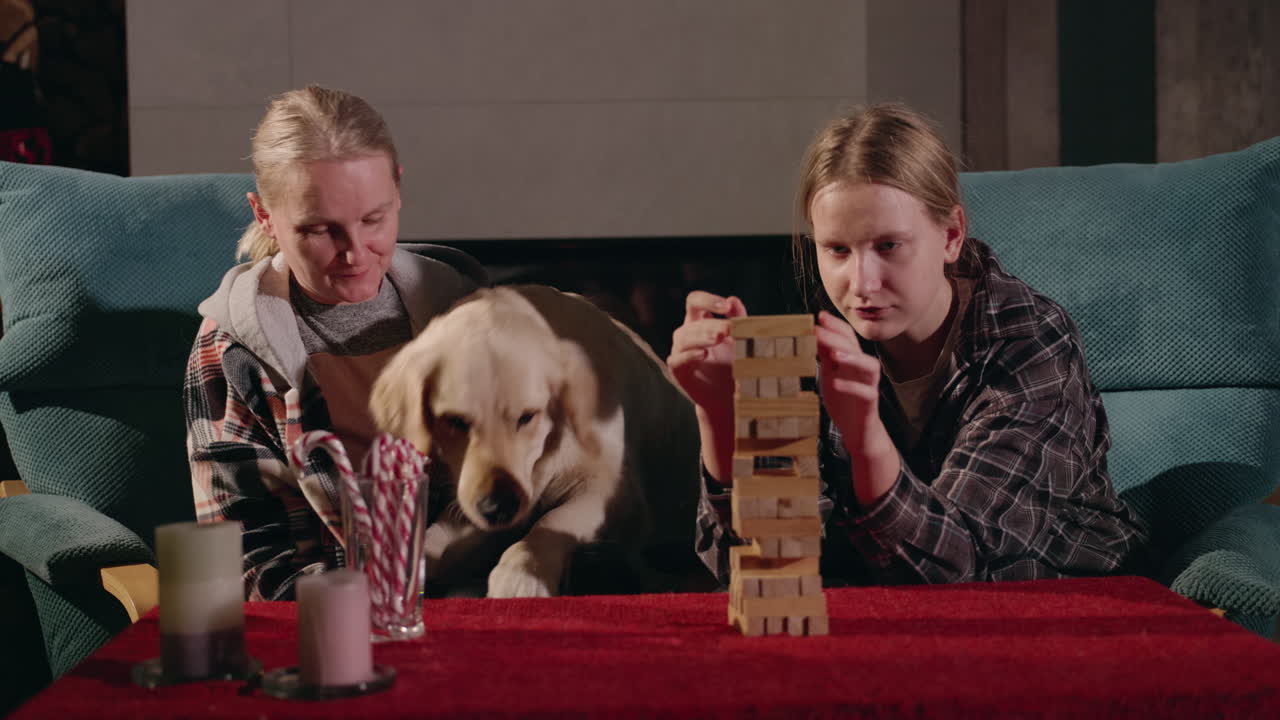 Family Playing Jenga with Dog