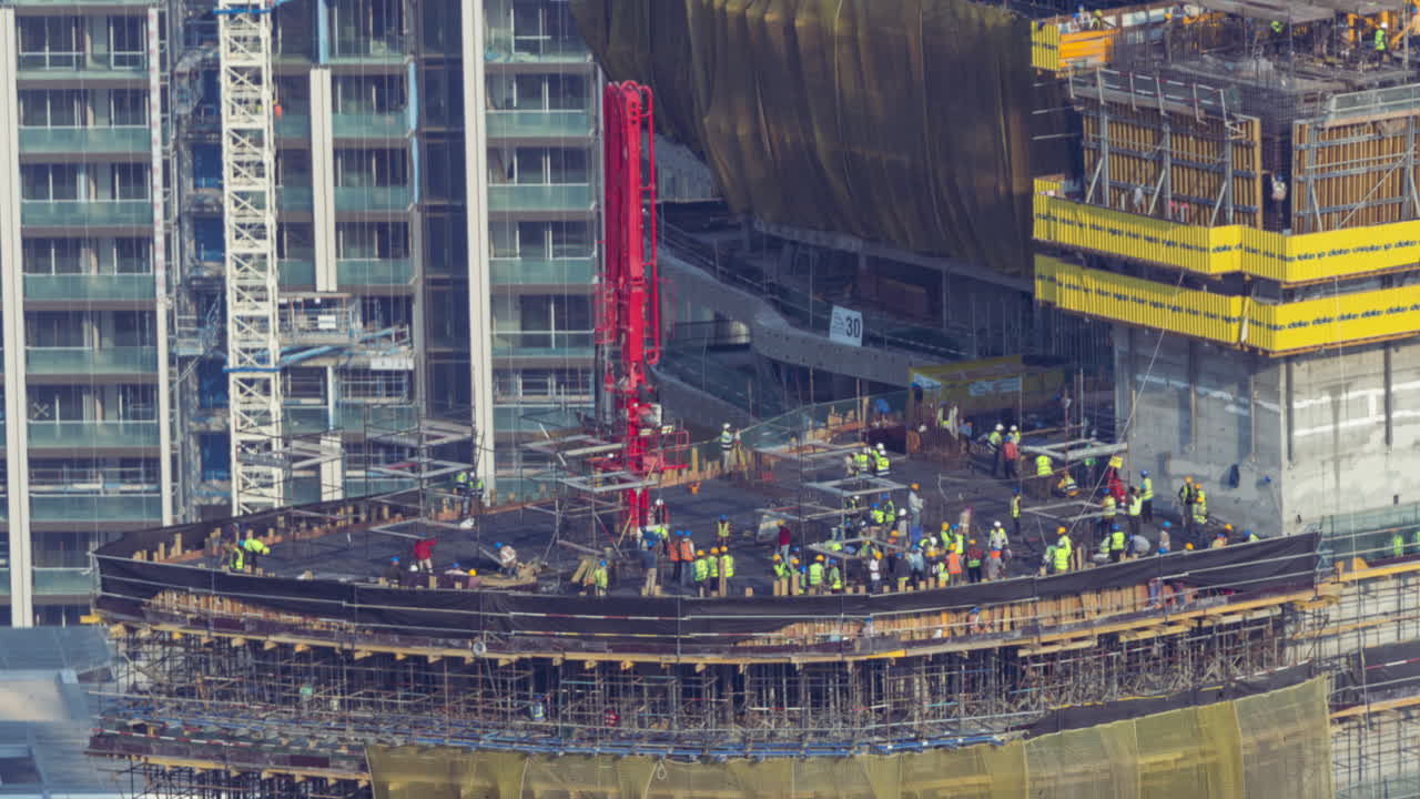 Time Lapse of Construction Workers Building a High-Rise Skyscraper