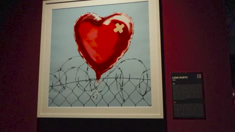 banksy's love hurts: a heart-wrenching piece of street art