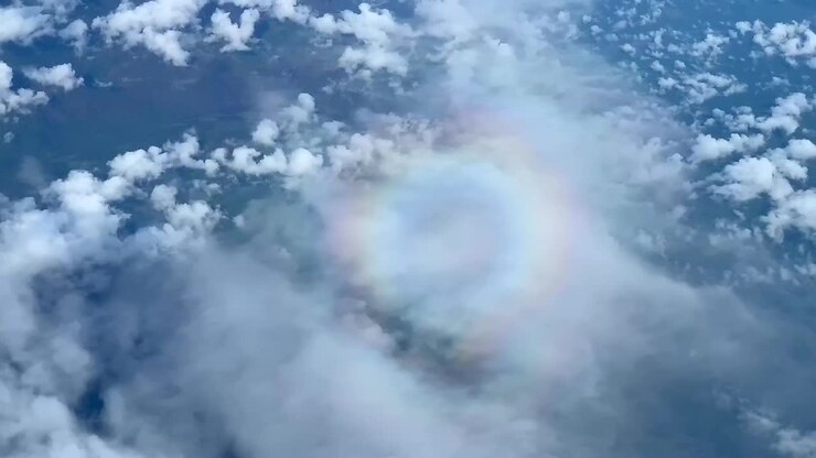 A "pilot's halo" also known as a "pilot's glory" seen from the window seat of an airplane flying above the clouds