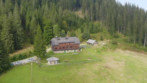 a wide aerial view of countryside houses in the mountains forest at sostanj, slovenia