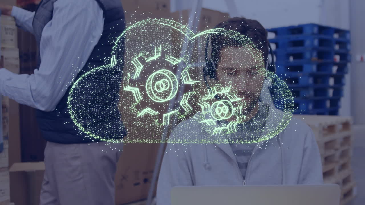 Cloud computing animation over person working on laptop in office setting