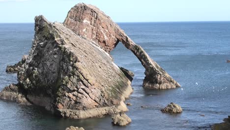 Bow-Fiddle-Rock-from-the-clifftop-on-a-sunny-calm-day-long-view