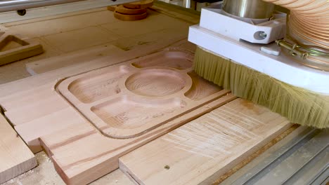 cnc router machine cutting on the wooden board