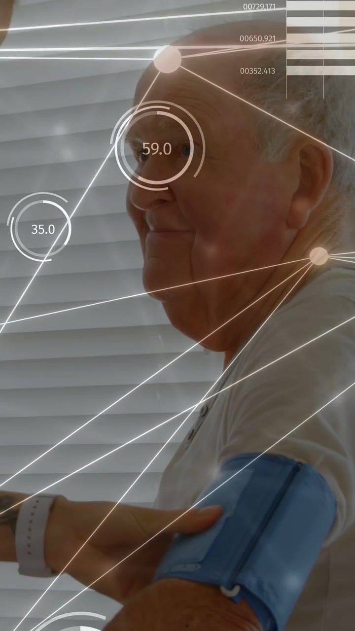 Vertical video: Caregiver placing blue cuff on man, inflating and showing HUD over arm measuring BP