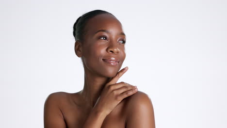 Skincare,-black-woman-and-touch-face-in-studio