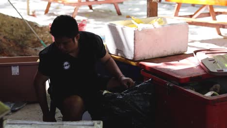 person organizing and packing materials systematically