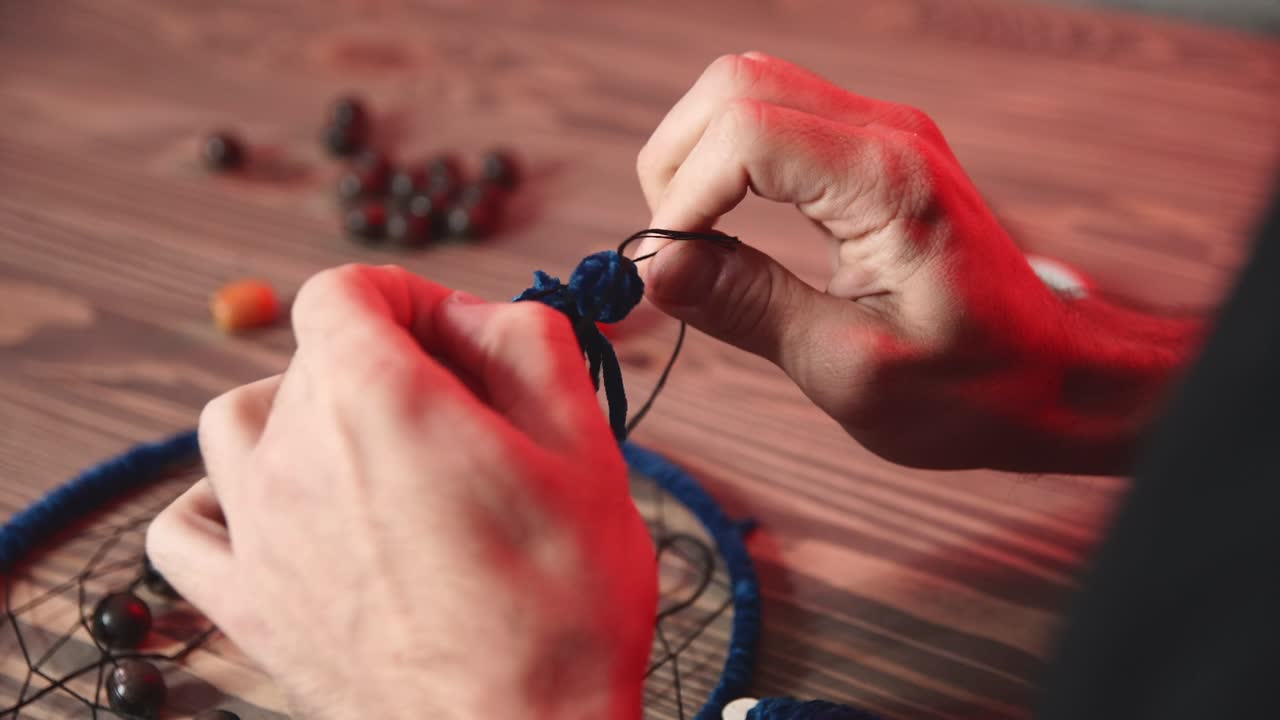Young man works in authentic art studio.