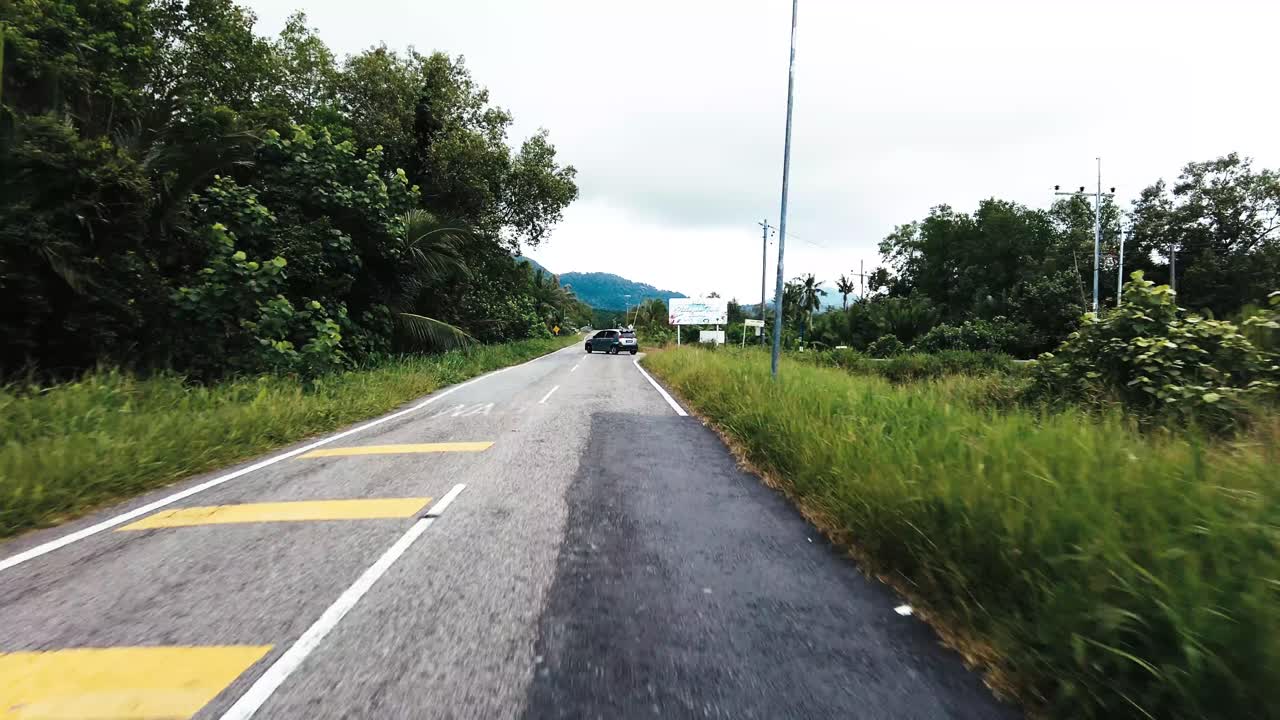 Beautiful View Drive Along Sempadi Lundu Coastal Road with Green Forest and Mountain,Sarawak,Borneo.