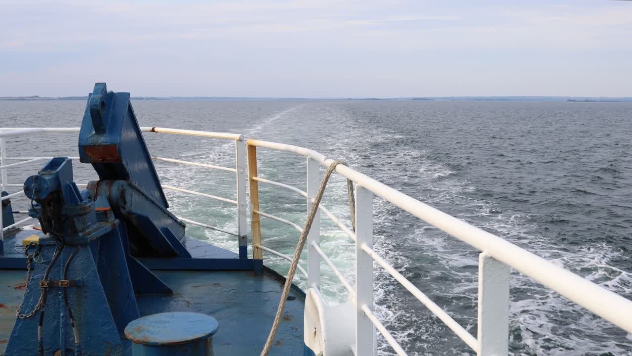 Wake behind the back of industrial boat crossing the sea, establisher