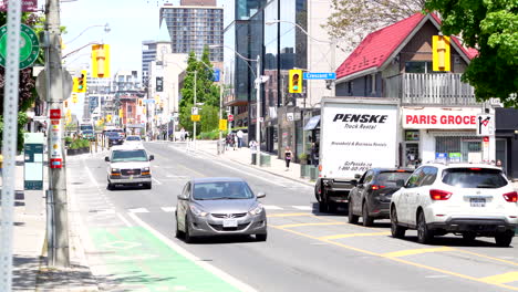yonge street toronto, cyclist traveling south in bike lane, summerhill area