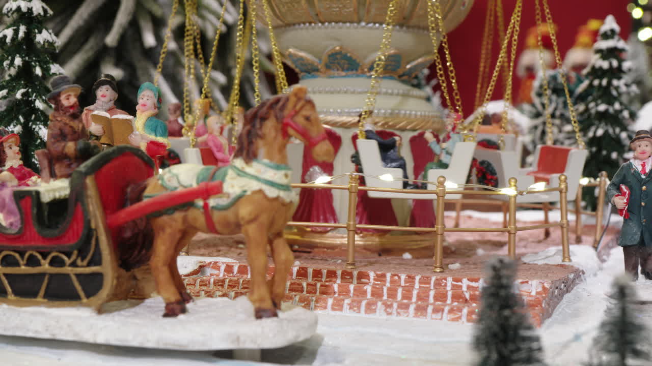 Miniature Christmas Village with Rotating Carousel and Sleigh