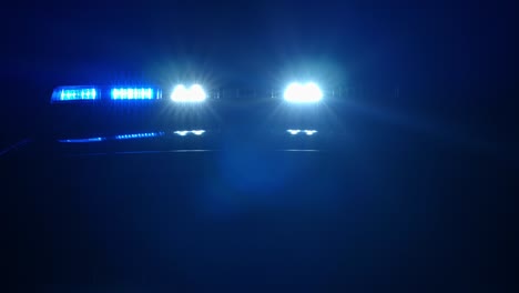 police car lights, red, blue,white in the dark