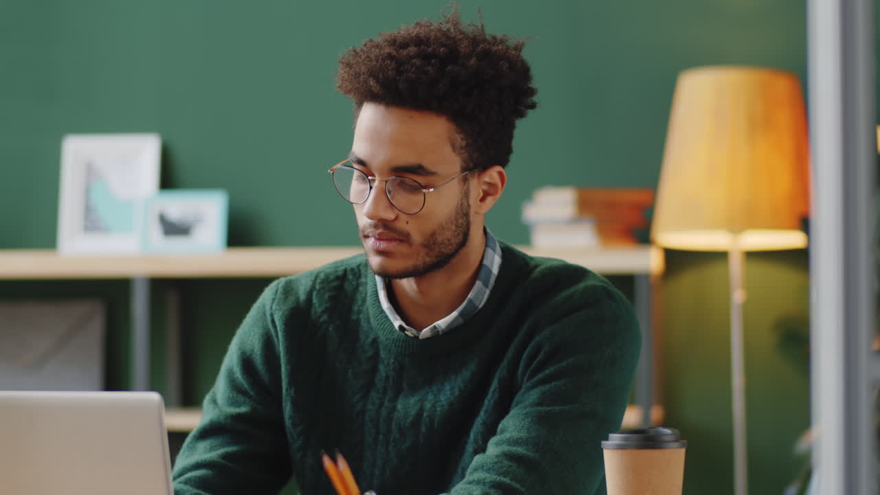 Young Professional Working at Laptop