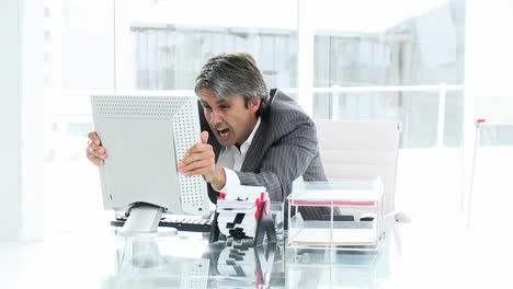 disconsolate businessman working at a computer