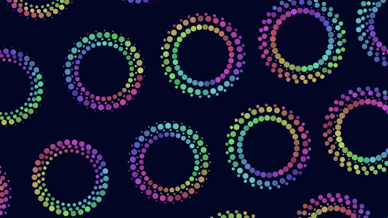 Colorful circles arranged in a symmetrical circular pattern create a seamless design in this image. The circles overlap each other, forming a visually appealing and repetitive pattern