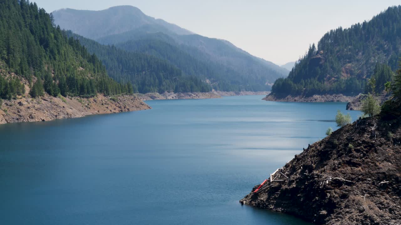 Slow motion landscape of Cougar water reservoir dam lake river with rocky mountains hills forest of Oregon USA America nature Terwilliger travel tourism nature wilderness
