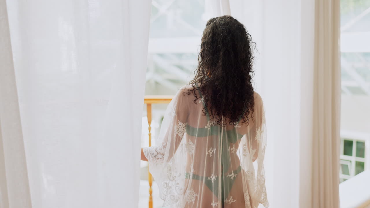 Woman standing by the window