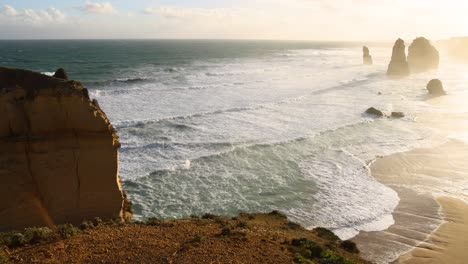 waves crashing against iconic limestone stacks