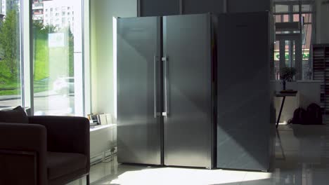 modern stainless steel refrigerator display in a showroom