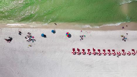 destin florida slowly trucking right straight down aerial drone shot of the white sand beach and emerald green water of the gulf of mexico