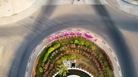 aerial tilt-up view from fountain of arch 22 entrance of banjul city, gambia with i love banjul letters