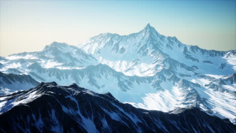 aerial view from airplane of blue snow covered canadian mountain landscape