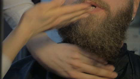 close up view of woman hands cares of beard