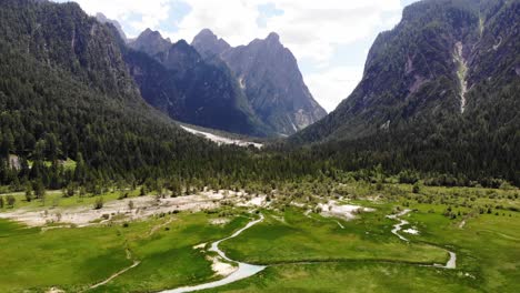 amazing natural area in dolomites with big mountains and a lot of trees