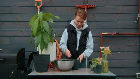 woman planting plants outdoors