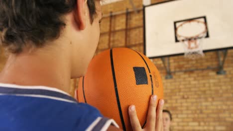 Determined-high-school-kids-playing-basketball