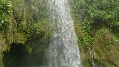 Aerial-shot-Inambakan-waterfalls-colourful-green-blue-water,-Cebu,-Philippines