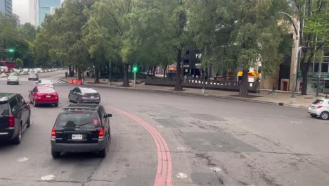 slow motion shot of reforma avenue dense traffic in mexico city