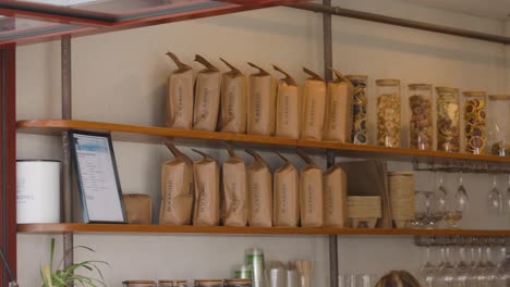 shelves with coffee bags and glassware