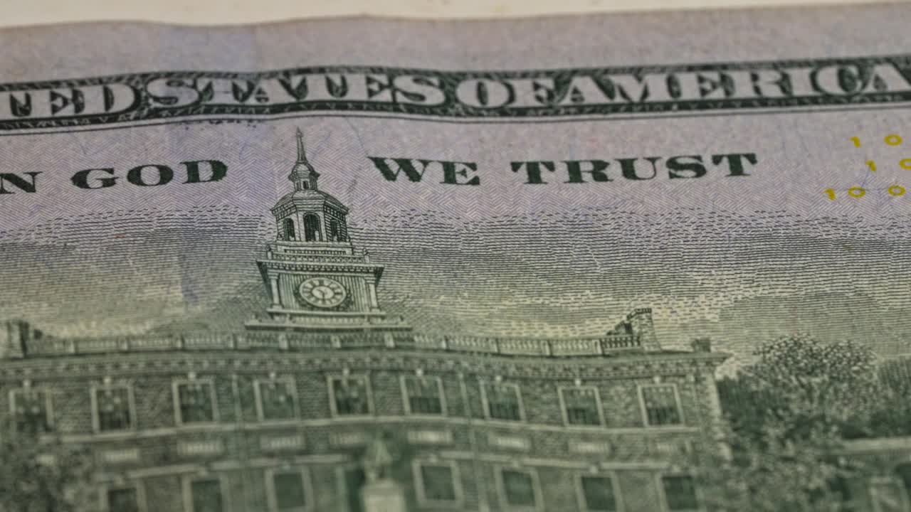 Close-up view of the United States currency with a historic building