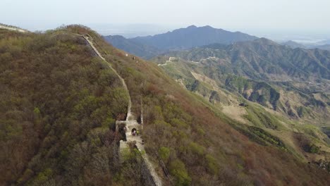 very few tourists on remote wild ridge section of great wall of china