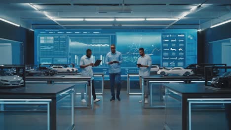 Automotive Design Team Collaborating in a High-Tech Studio with Car Models and Data Displays