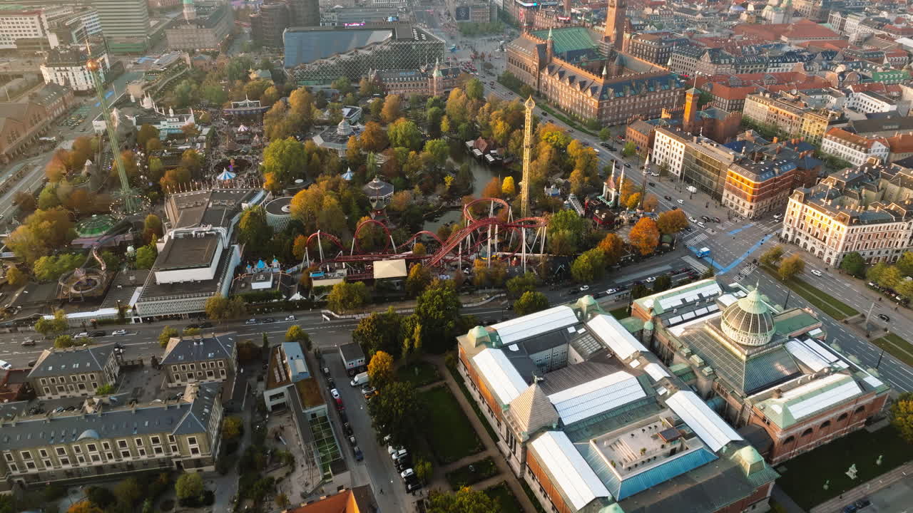Aerial drone view of the Tivoli amusement park and the City Hall in Copenhagen, Denmark at sunset
