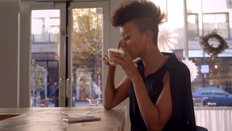 stylish woman connecting with social media in cafe