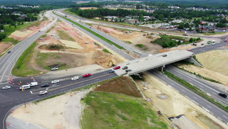 drone shot of new bridge construction over busy highway