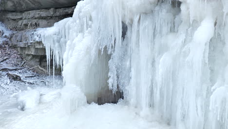 beautiful pan of frozen waterfall, winter landscape concept