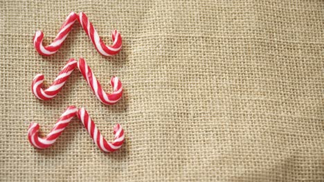 candy cane arranged on textile 4k