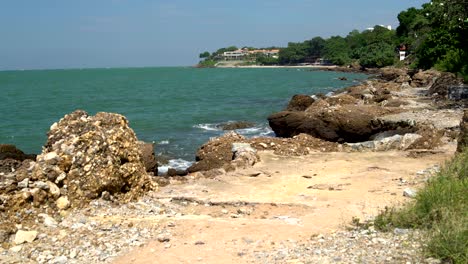 landscape. sky. sea. waves. rocky shore. house on the seaside