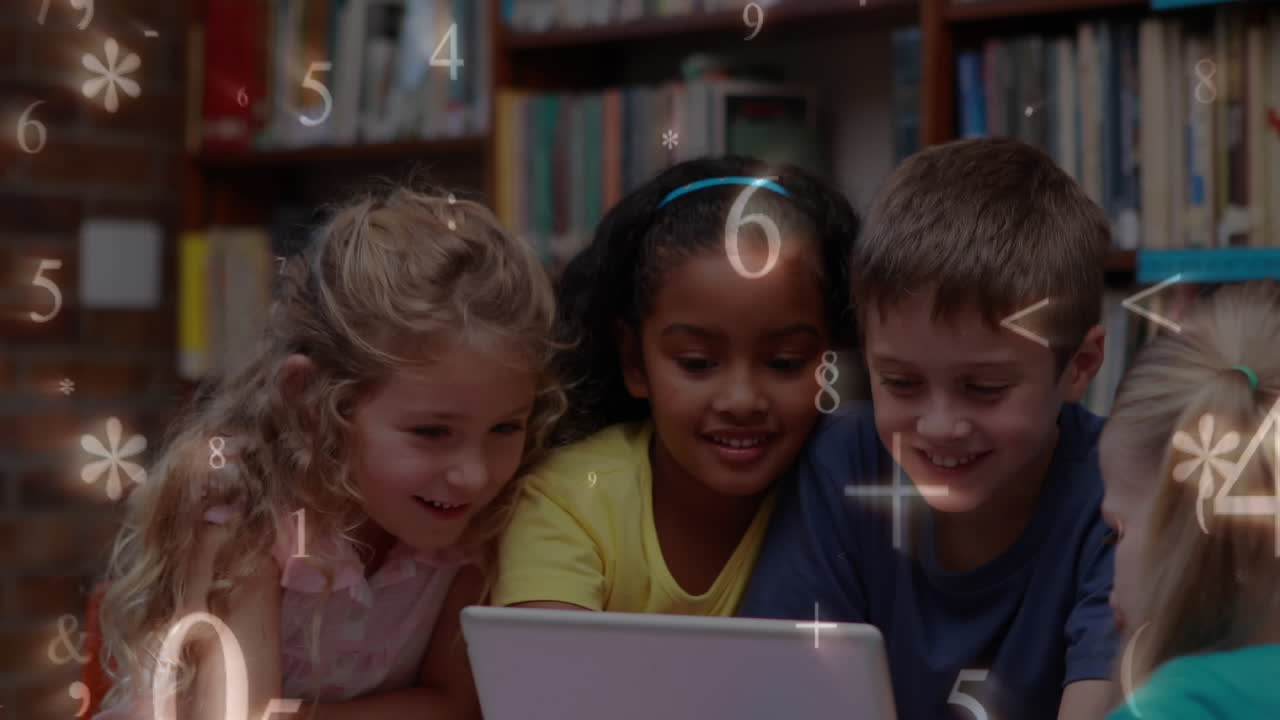 Kids studying on a tablet in the library